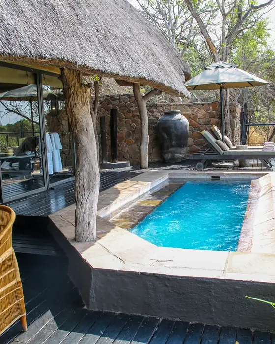 A private exclusive-use safari villa with a pool overlooking the bush