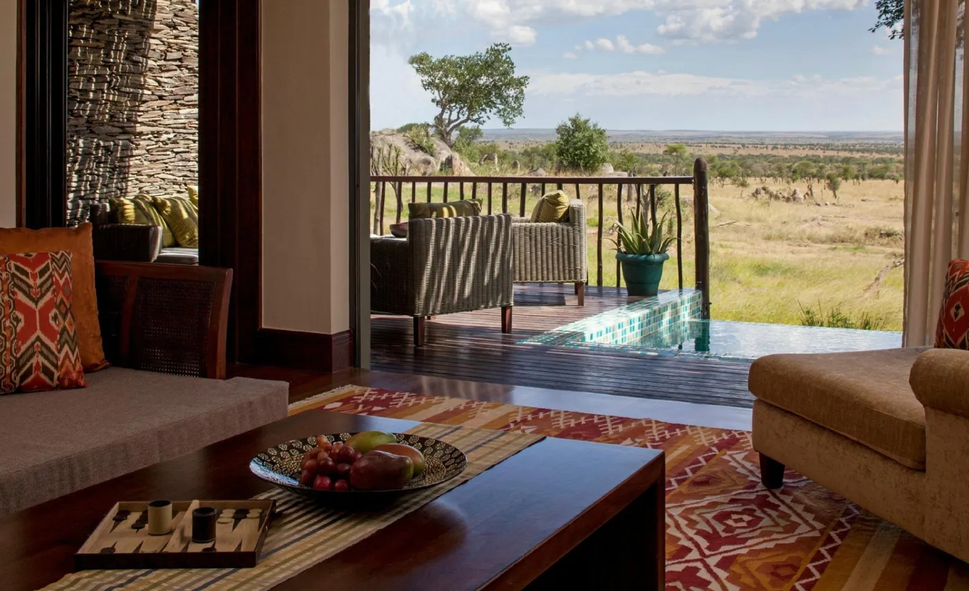 A suite at Four Seasons Safari Lodge Serengeti opening onto a private plunge pool and the Serengeti plains