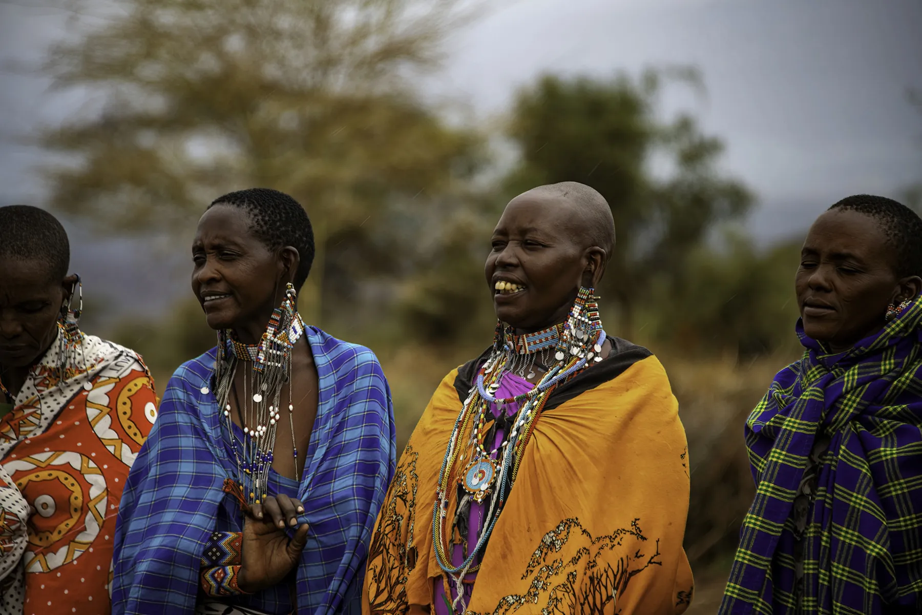 Maasai women in bright shukas and beaded jewellery near Ngorongoro, Tanzania