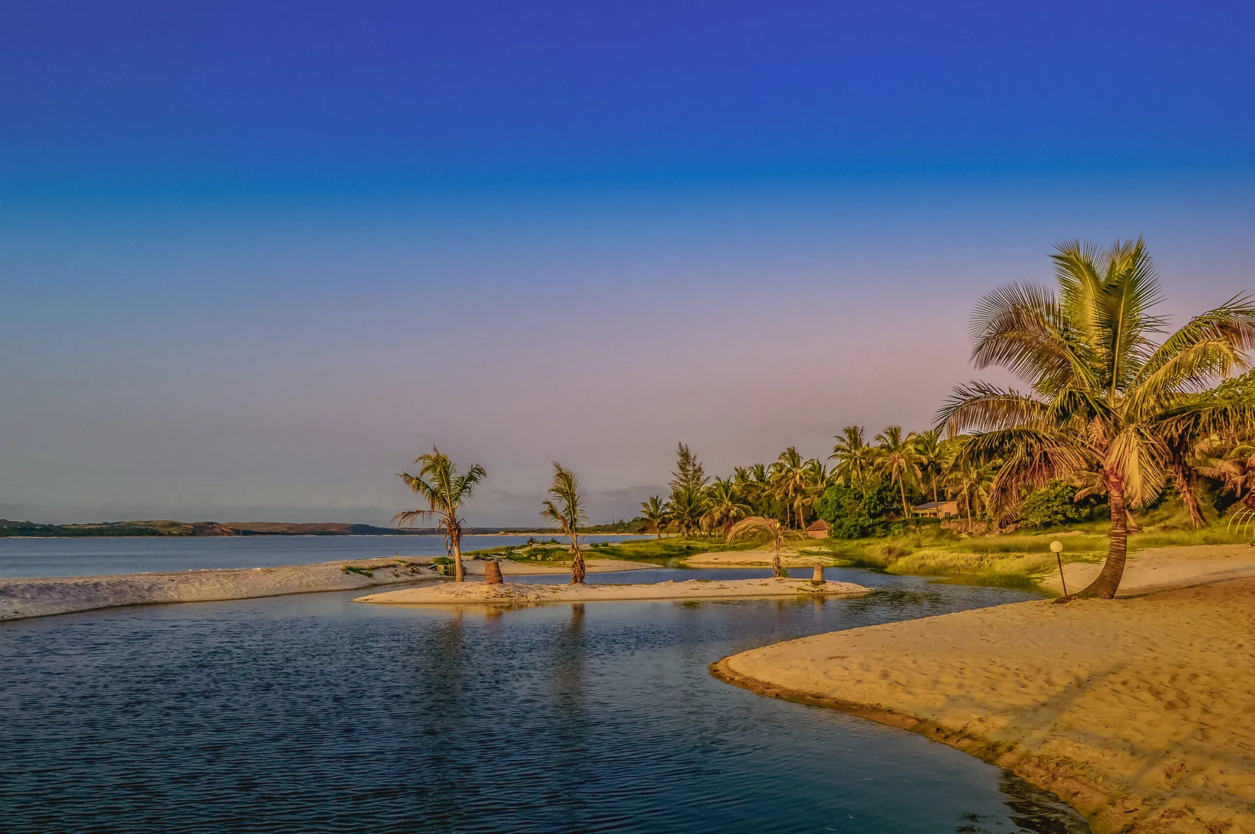 A palm-fringed lagoon and sandbar on the Mozambique coast