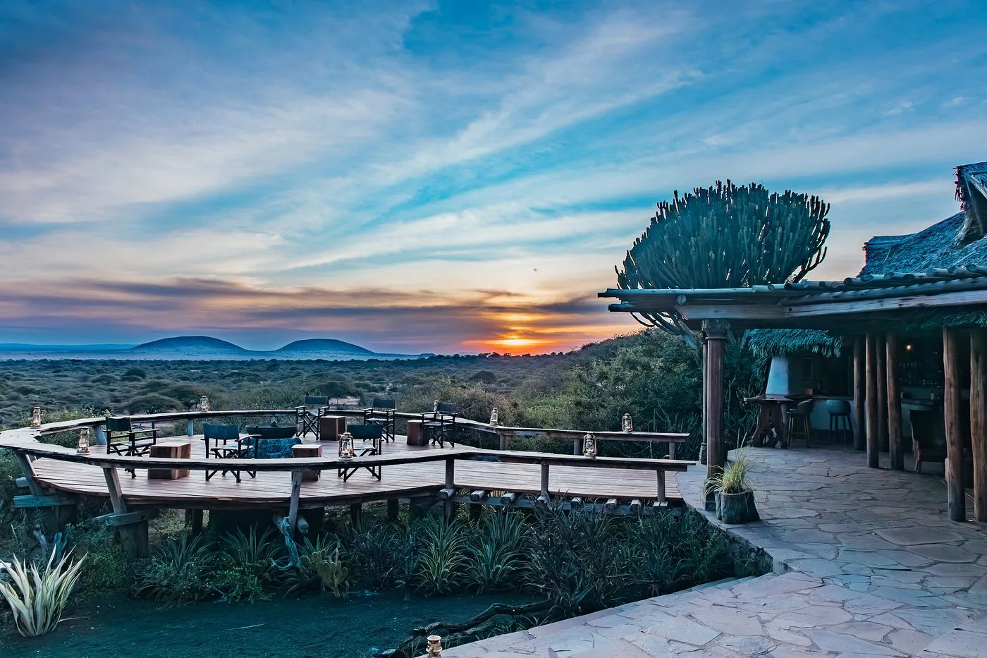 The deck at ol Donyo Lodge at sunset, looking across the plains of the Chyulu Hills in Kenya