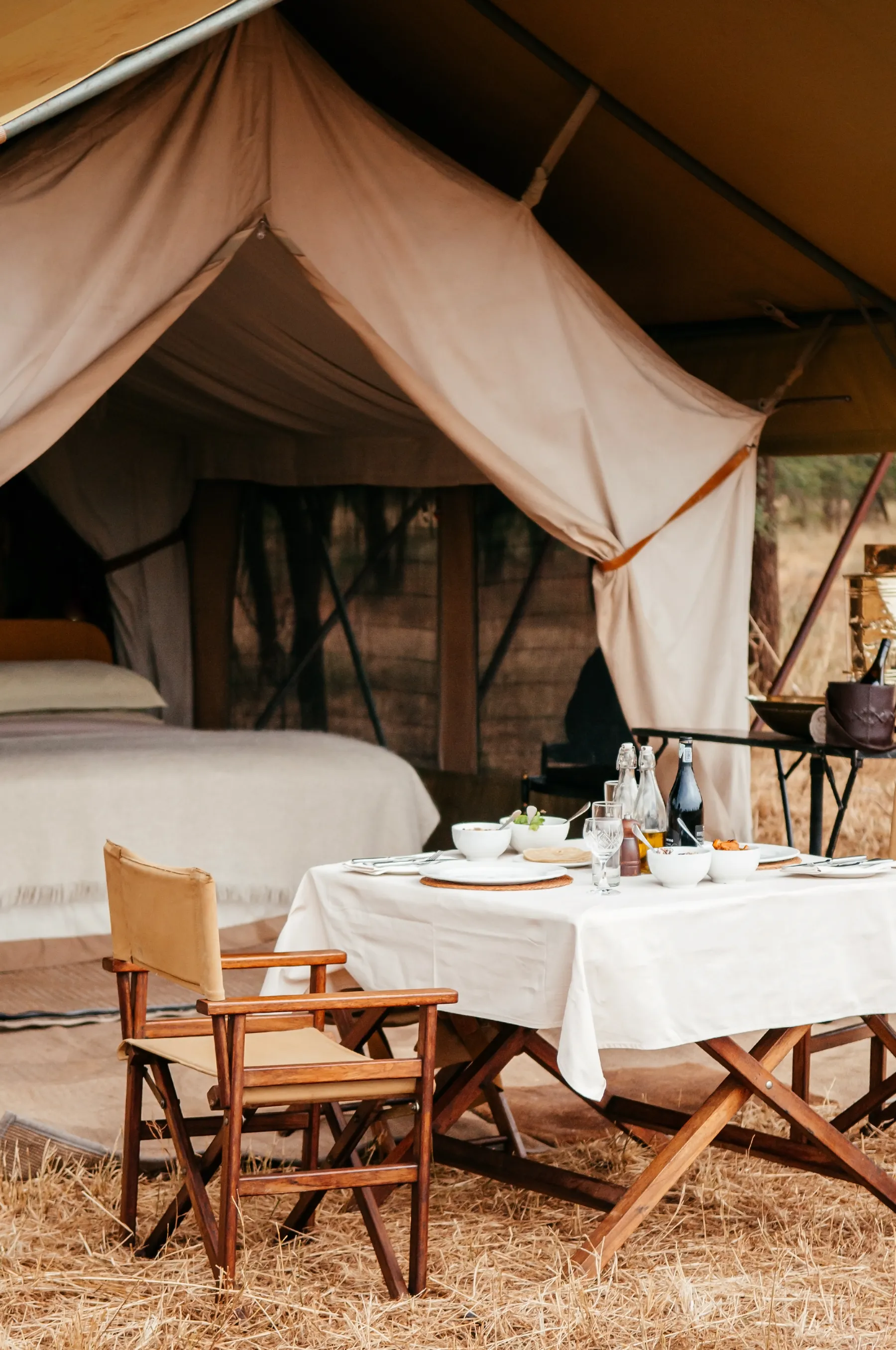 Exclusive-use tented camp at dusk in the African bush