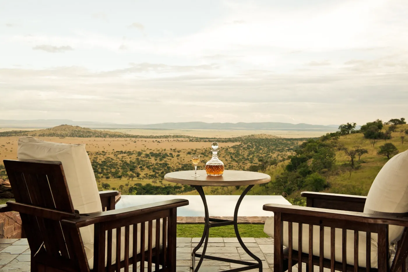 A terrace with a plunge pool at Singita Sasakwa Lodge overlooking the plains of the western Serengeti, Tanzania