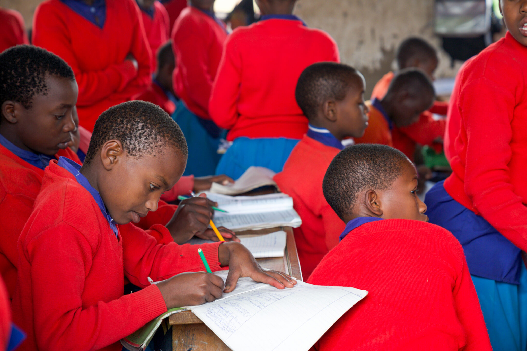 Travelers meet local students at a school supported by Nndeeafrika’s initiative during their Luxury African Safari in Tanzania