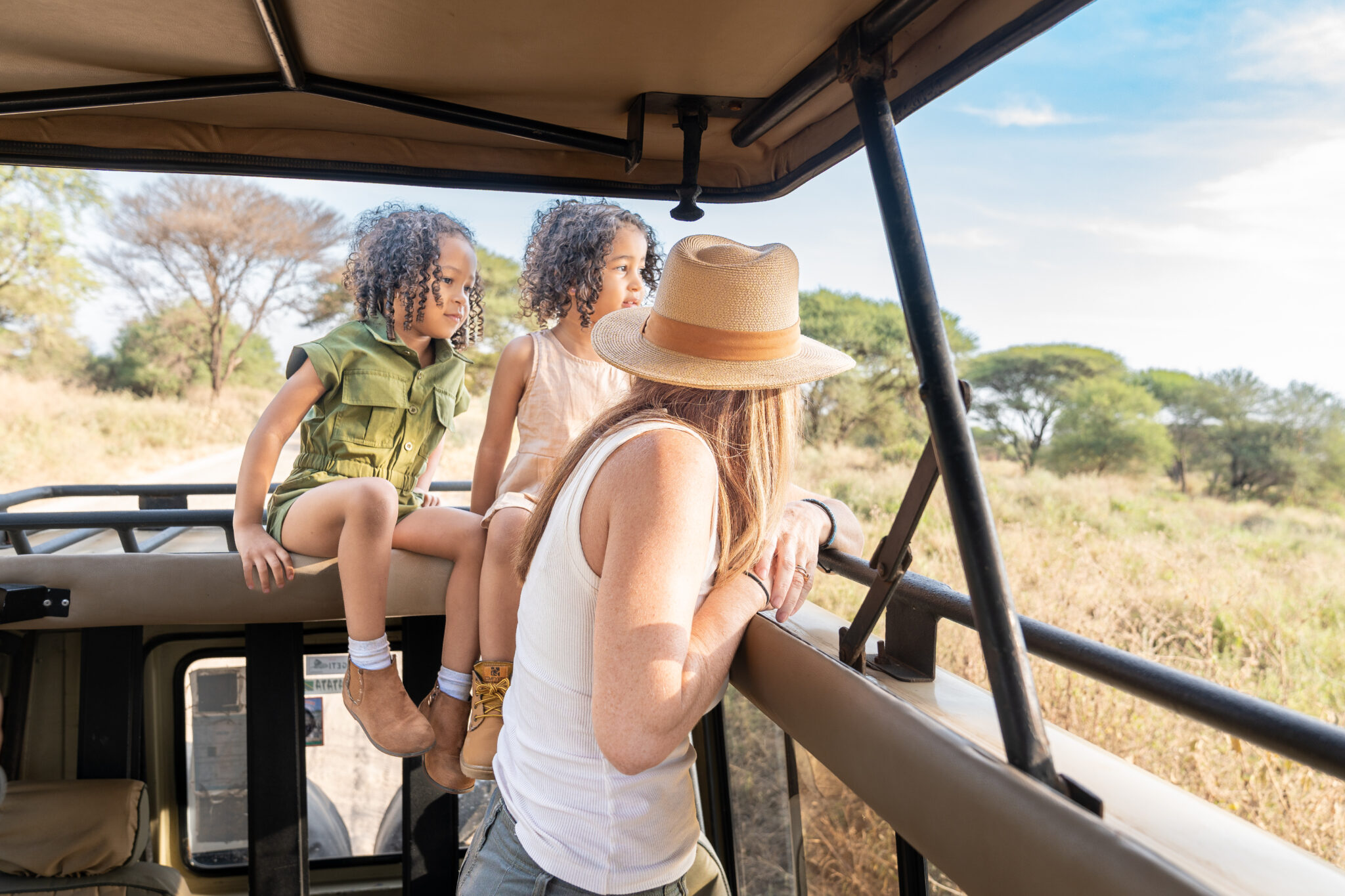 Happy family on safari enjoying a luxury African adventure with breathtaking wildlife encounters – unforgettable family luxury African safari tours by Nndeeafrika.