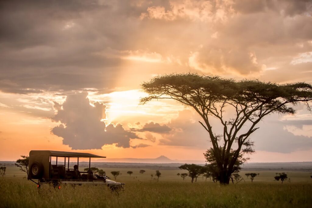 Panoramic view of the Grumeti Reserve with the lodge in the distance during sunset.