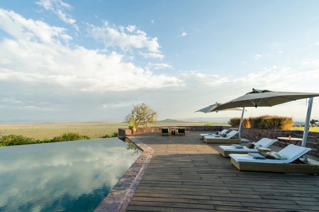 Exterior view of Sasakwa Luxury Lodge set against the expansive Grumeti landscape