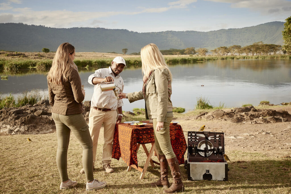 enjoying a luxury safari picnic lunch from Ngorongoro Crater Camp