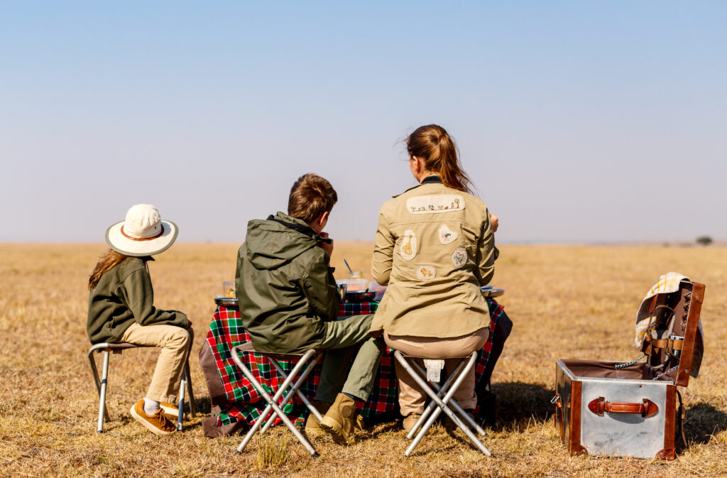 Mother and Children observing wildlife on a Kenyan safari